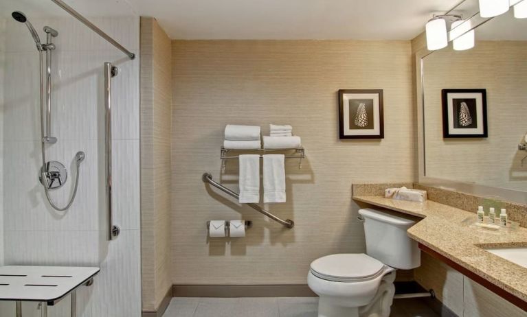 Private guest bathroom with shower and free toiletries at the Holiday Inn Oakville Centre.
