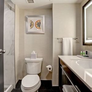 Private guest bathroom with shower and free toiletries at the Four Points By Sheraton St Catharines Niagara Suites. 