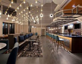 Dining area with lounge sitting perfect for co-working at the Four Points By Sheraton St Catharines Niagara Suites.