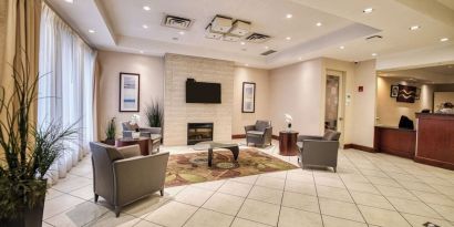 Hotel lobby with lounge area at Amenida Residences.