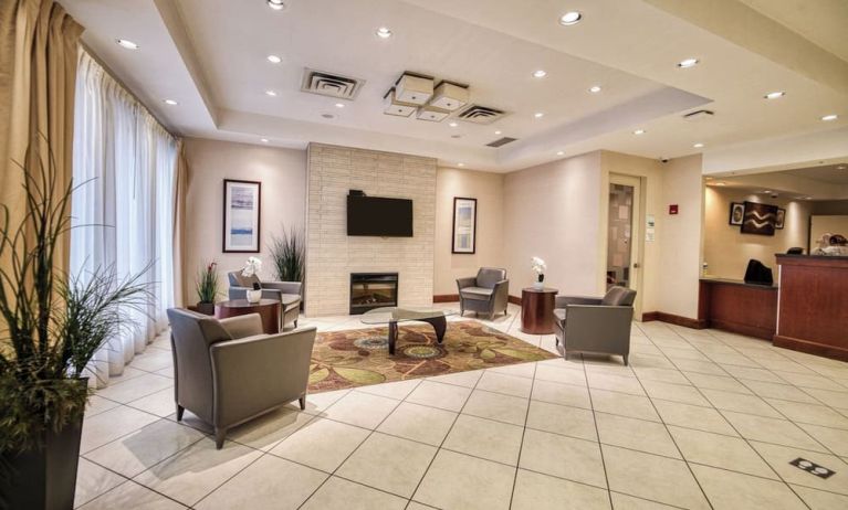 Hotel lobby with lounge area at Amenida Residences.