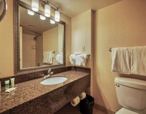 Private guest bathroom with shower and free toiletries at Amenida Residences.