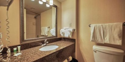 Private guest bathroom with shower and free toiletries at Amenida Residences.