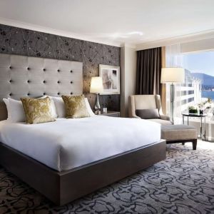 Day use room with TV, work desk, sofa and private bathroom at the Fairmont Waterfront.