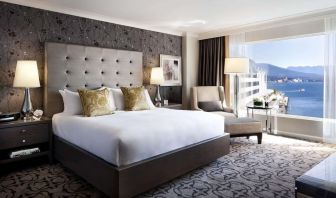 Day use room with TV, work desk, sofa and private bathroom at the Fairmont Waterfront.