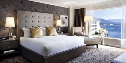 Day use room with TV, work desk, sofa and private bathroom at the Fairmont Waterfront.