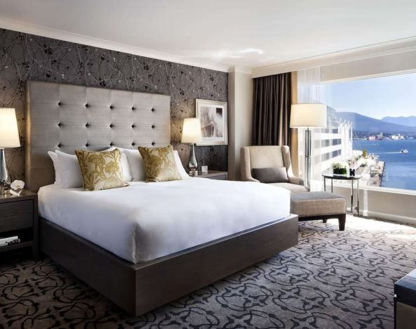 Day use room with TV, work desk, sofa and private bathroom at the Fairmont Waterfront.