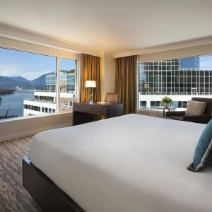 Day use room with work desk, sofa and private bathrom at the Fairmont Waterfront.