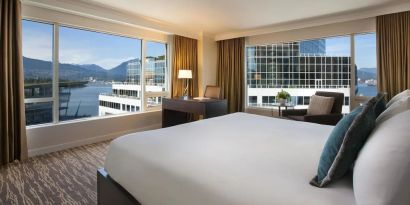 Day use room with work desk, sofa and private bathrom at the Fairmont Waterfront.