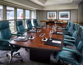 Professional meeting room with large windows and ergonomic chairs at the Fairmont Waterfront.