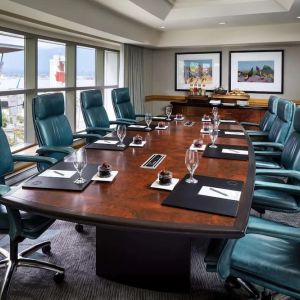 Professional meeting room with large windows and ergonomic chairs at the Fairmont Waterfront.