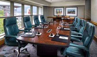 Professional meeting room with large windows and ergonomic chairs at the Fairmont Waterfront.