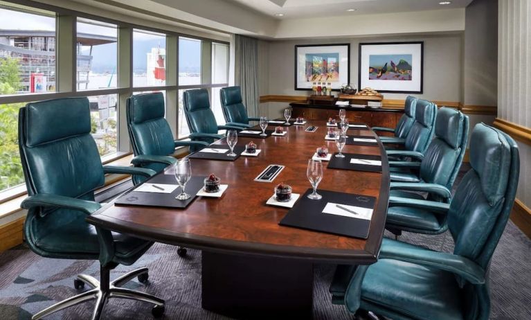 Professional meeting room with large windows and ergonomic chairs at the Fairmont Waterfront.