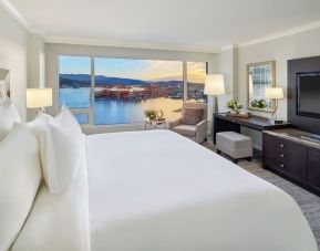 Day use room with TV, work desk, sofa and private bathroom at the Fairmont Waterfront.