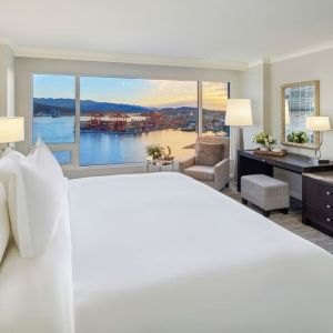 Day use room with TV, work desk, sofa and private bathroom at the Fairmont Waterfront.