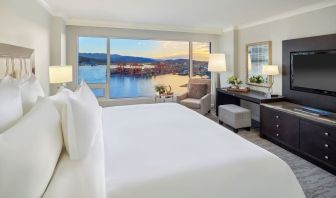 Day use room with TV, work desk, sofa and private bathroom at the Fairmont Waterfront.