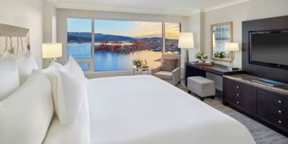 Day use room with TV, work desk, sofa and private bathroom at the Fairmont Waterfront.