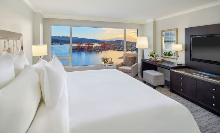 Day use room with TV, work desk, sofa and private bathroom at the Fairmont Waterfront.