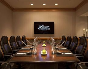 Professional meeting room with TV scree, and ergonomic chairs at the Fairmont Waterfront.