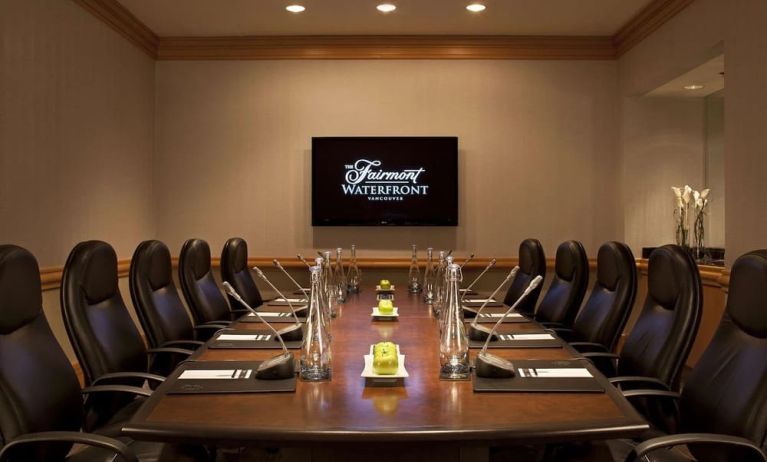 Professional meeting room with TV scree, and ergonomic chairs at the Fairmont Waterfront.