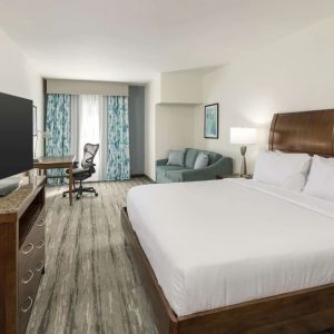 Day use room with work desk and sofa at Hilton Garden Inn Boca Raton.