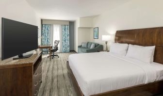 Day use room with work desk and sofa at Hilton Garden Inn Boca Raton.