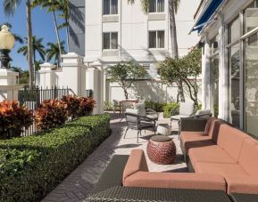 Outdoor seats available at Hilton Garden Inn Boca Raton.