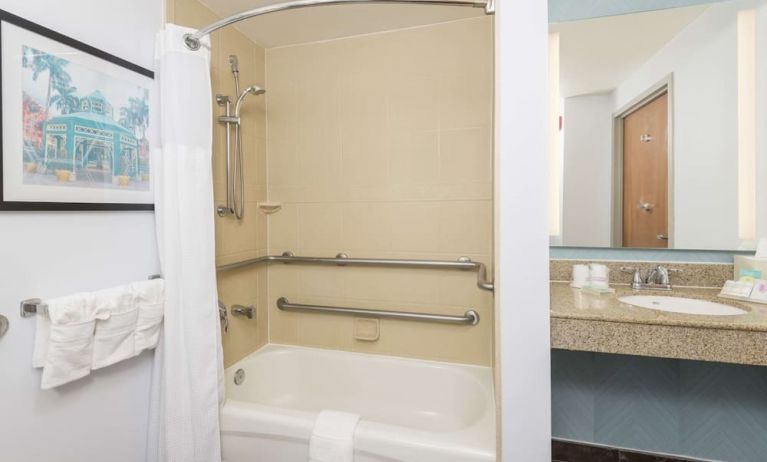 Guest bathroom with shower and tub at Hilton Garden Inn Boca Raton.