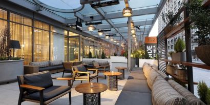 Veranda with ample seats at Innside By Melia New York Nomad.