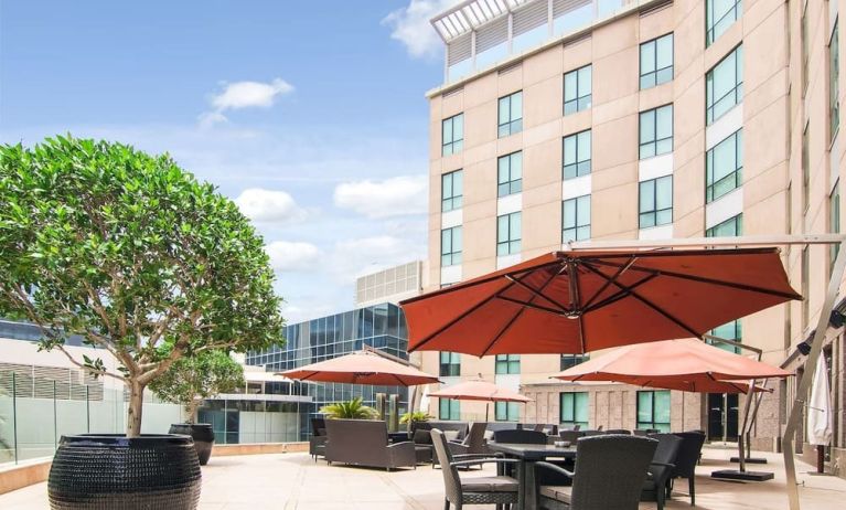 Balcony with ample seating at Radisson Blu Hotel Dubai Media City.