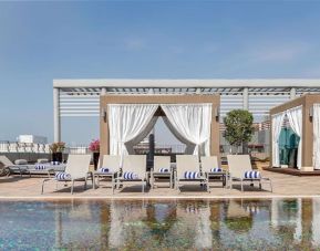 Sun loungers and cabanas available at Radisson Blu Hotel Dubai Media City.