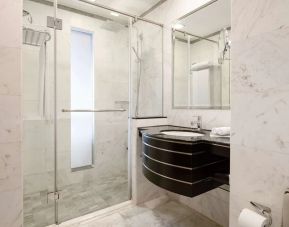 Guest bathroom with shower at Radisson Blu Hotel Dubai Media City.