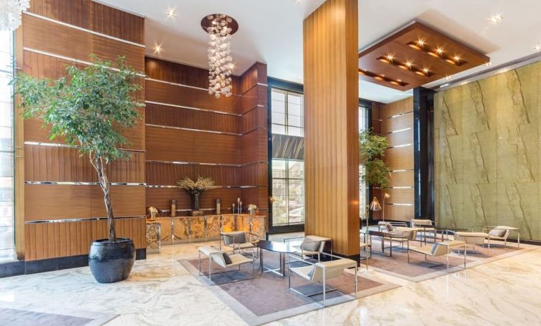 Lobby and coworking lounge at Radisson Blu Hotel Dubai Media City.