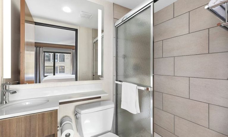 Guest bathroom with shower at Holiday Inn Manhattan 6th Ave - Chelsea.