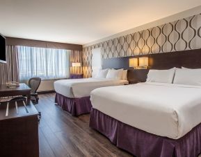 Day use twin room with TV, sofa, work desk and private bathroom at Holiday Inn Toronto International Airport.