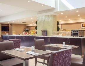 Dining area with comfortable seating at Holiday Inn Toronto International Airport.