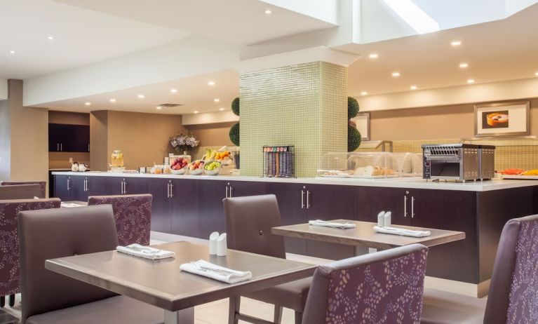 Dining area with comfortable seating at Holiday Inn Toronto International Airport.