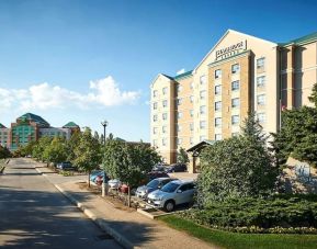 Hotel exterior with parking area at Staybridge Suites Oakville-Burlington.