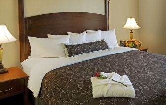 King bed at Staybridge Suites Oakville-Burlington.