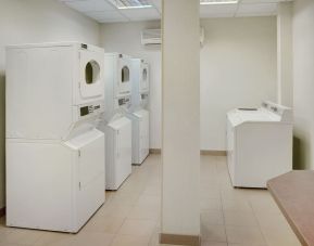 Laundry room at Staybridge Suites Oakville-Burlington.