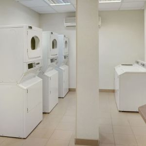 Laundry room at Staybridge Suites Oakville-Burlington.