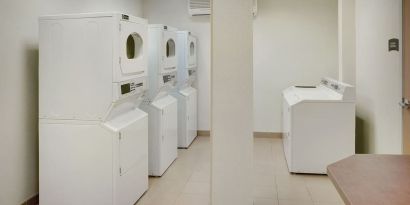 Laundry room at Staybridge Suites Oakville-Burlington.