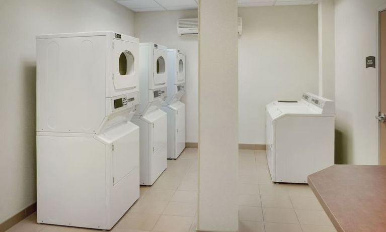 Laundry room at Staybridge Suites Oakville-Burlington.