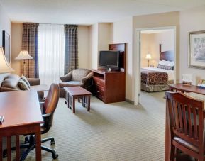 Studio suite with living room, kitchen, work desk and private bathroom at Staybridge Suites Oakville-Burlington.