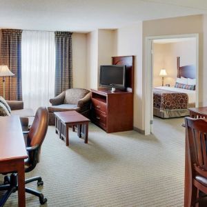 Studio suite with living room, kitchen, work desk and private bathroom at Staybridge Suites Oakville-Burlington.