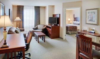 Studio suite with living room, kitchen, work desk and private bathroom at Staybridge Suites Oakville-Burlington.