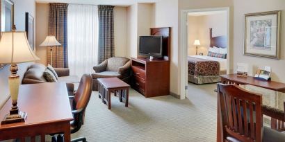 Studio suite with living room, kitchen, work desk and private bathroom at Staybridge Suites Oakville-Burlington.