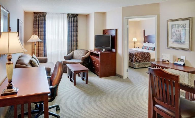 Studio suite with living room, kitchen, work desk and private bathroom at Staybridge Suites Oakville-Burlington.