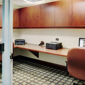 Business center with computers, printers and ergonomic chairs at Staybridge Suites Oakville-Burlington.