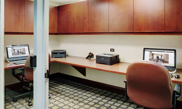 Business center with computers, printers and ergonomic chairs at Staybridge Suites Oakville-Burlington.